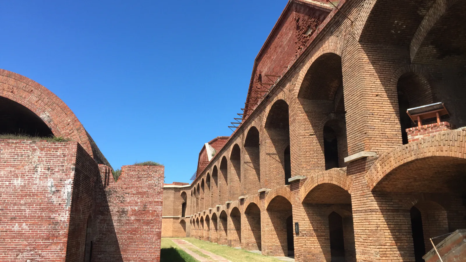 Sunlit brick arches and walkways inside Fort Jefferson at Dry Tortugas National Park