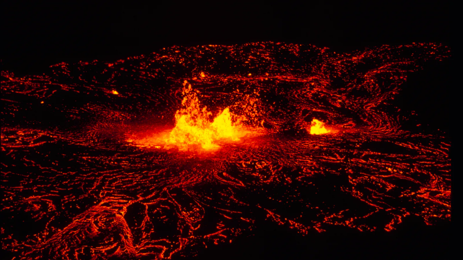 Dark volcanic terrain and native vegetation in Hawaiʻi Volcanoes National Park
