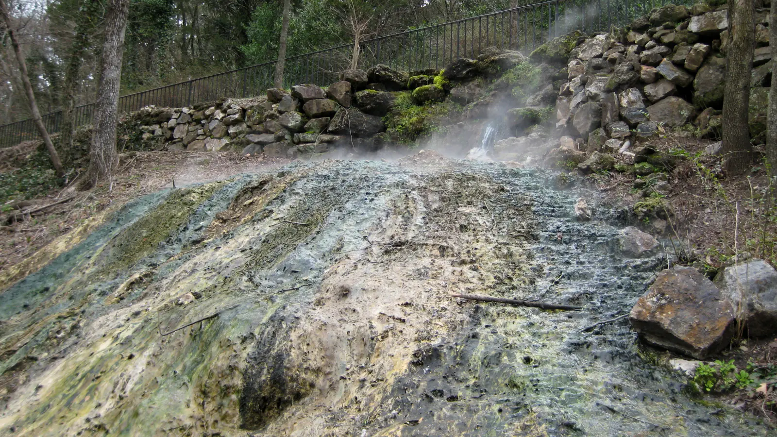 Forested ridges rise above the historic bathhouses and city of Hot Springs Arkansas