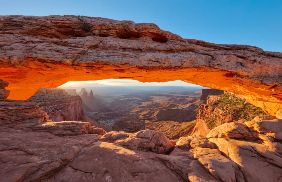 Sunrise glowing beneath Mesa Arch in Canyonlands National Park