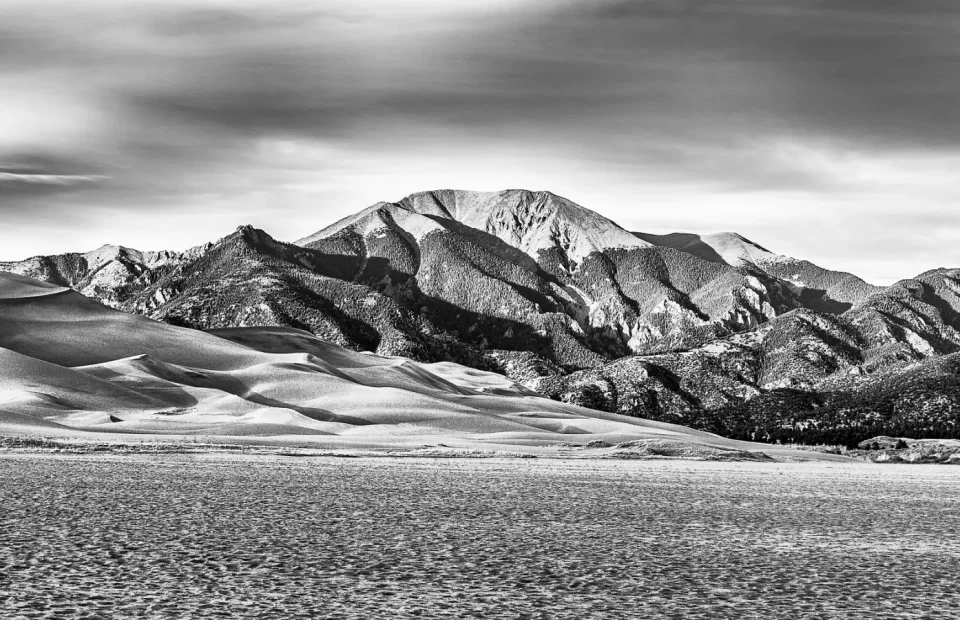 Sand ridges and grassland below Carbonate Mountain in Great Sand Dunes National Park